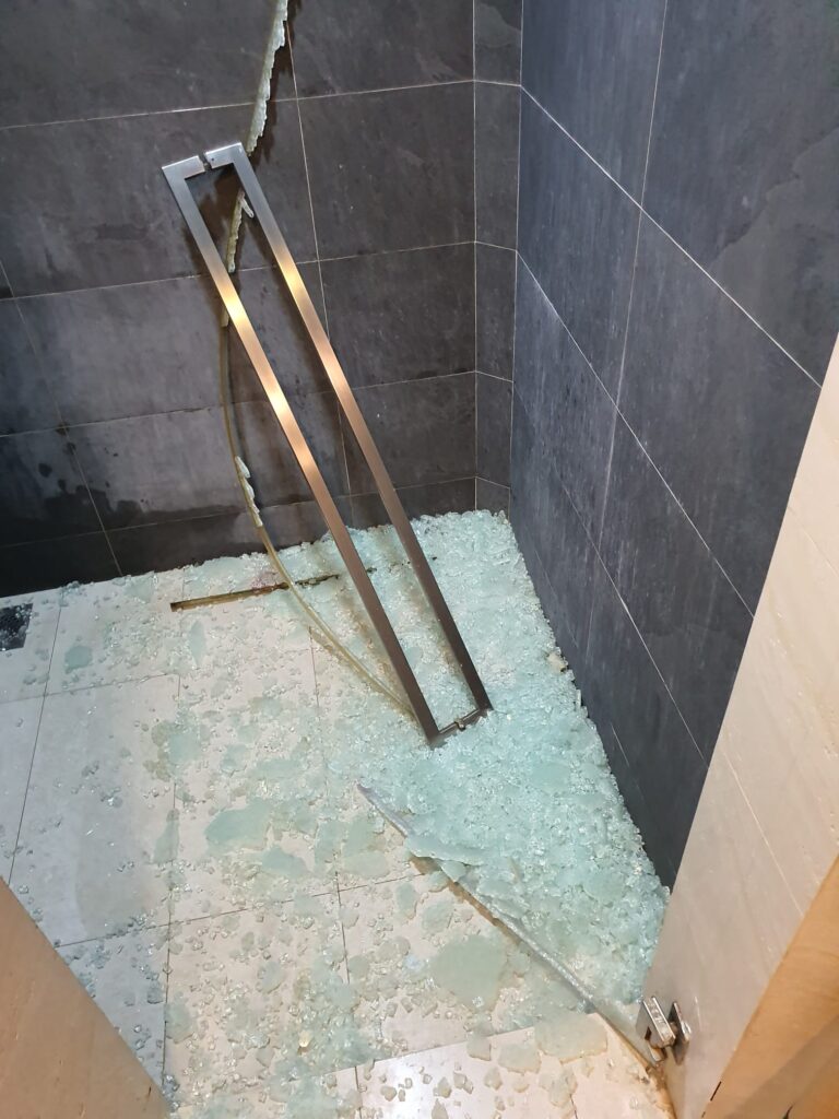 shattered bathroom tempered glass